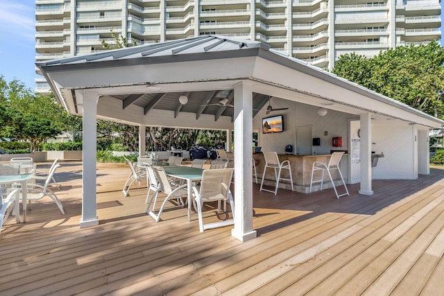 wooden deck featuring an outdoor bar and a gazebo