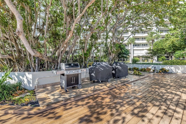 wooden terrace with area for grilling