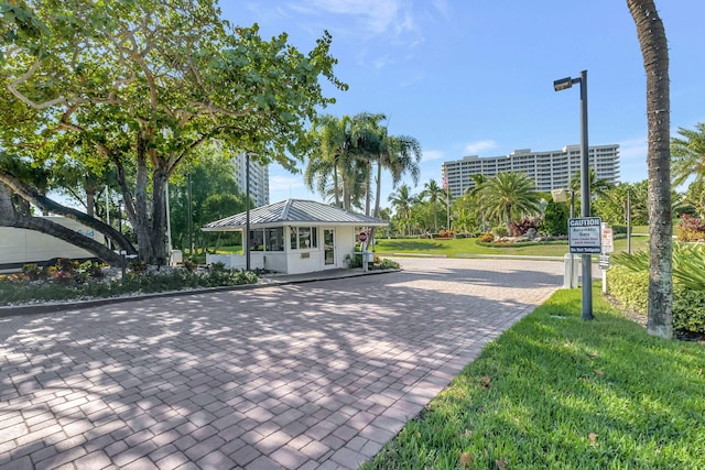 view of property's community with a yard