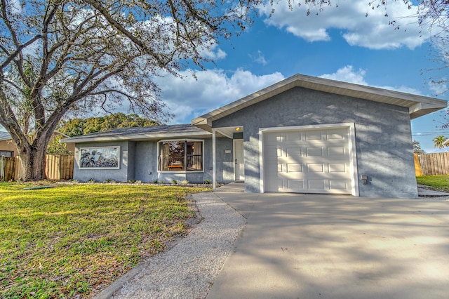 view of front facade featuring a garage and a front yard