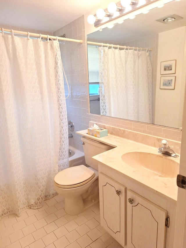 full bathroom featuring backsplash, vanity, shower / bath combo, tile patterned flooring, and toilet