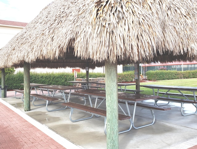 view of home's community with a lawn and a gazebo