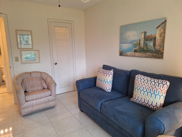 living room with light tile patterned floors