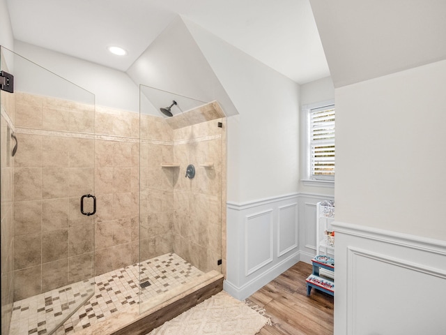 bathroom featuring hardwood / wood-style floors and an enclosed shower