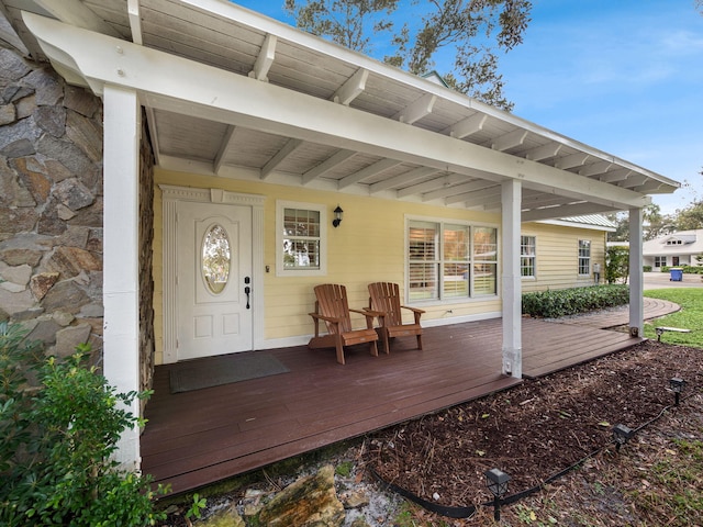 property entrance featuring covered porch