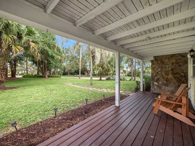 wooden deck with a lawn