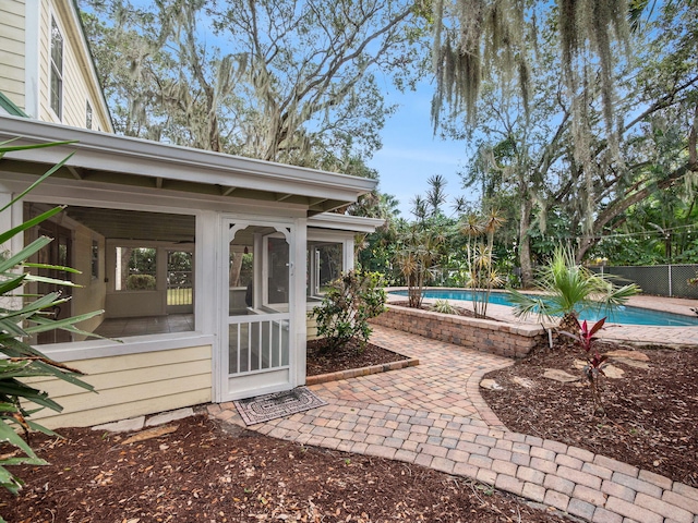 view of patio with a fenced in pool