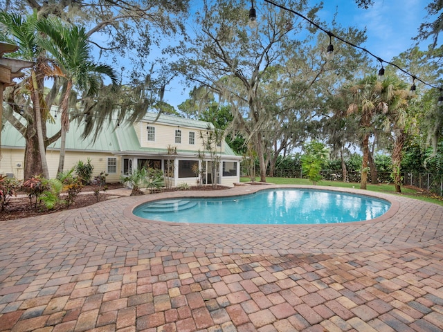 view of pool featuring a patio area