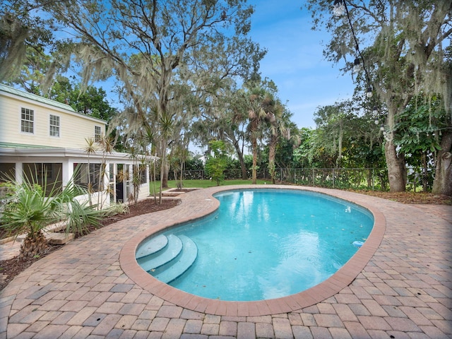 view of swimming pool with a patio area