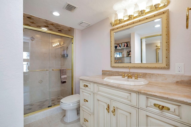 bathroom featuring toilet, tile patterned flooring, a textured ceiling, vanity, and walk in shower