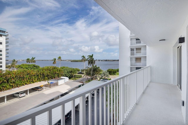 balcony featuring a water view