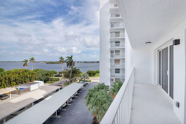 balcony featuring a water view