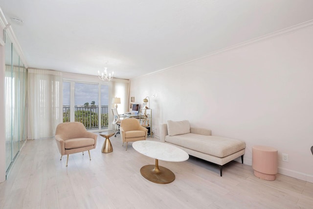 living room with ornamental molding, an inviting chandelier, and light hardwood / wood-style floors