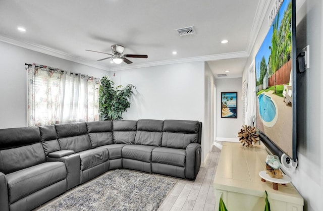 living room featuring ceiling fan, light hardwood / wood-style flooring, and ornamental molding