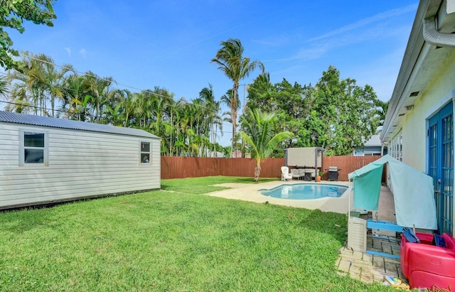 view of yard with a patio and a fenced in pool