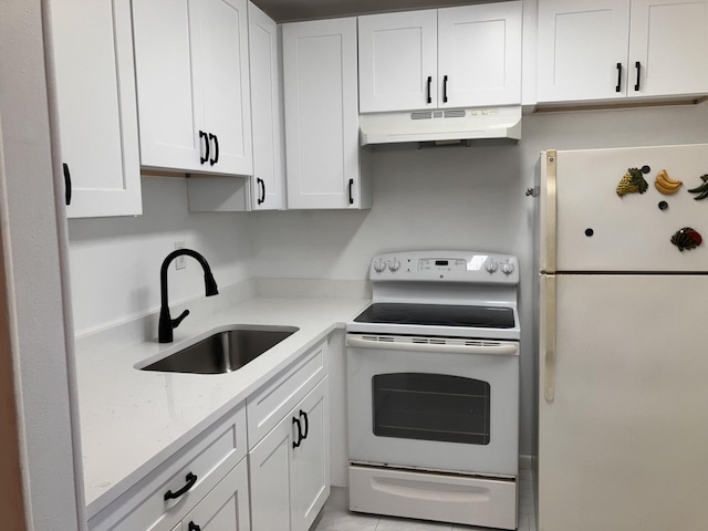 kitchen with light stone countertops, sink, light tile patterned floors, white appliances, and white cabinets