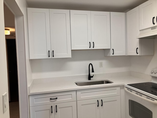 kitchen with sink, light stone counters, white range with electric cooktop, extractor fan, and white cabinets