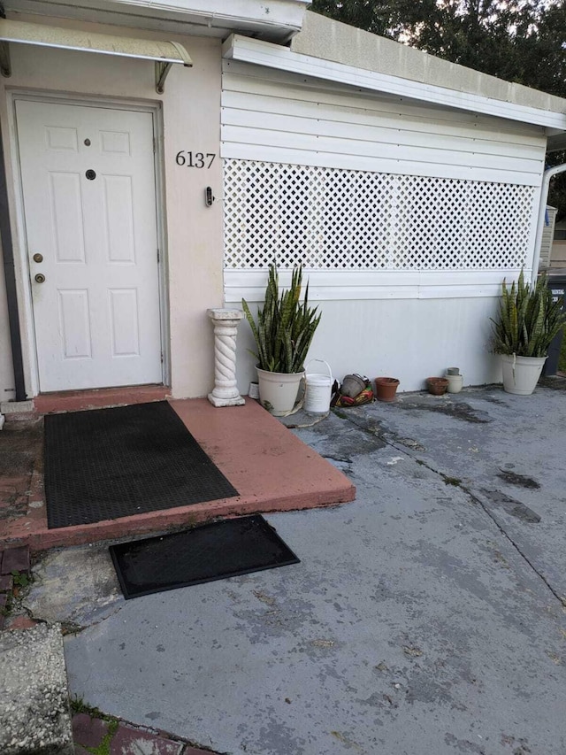 property entrance with a patio area