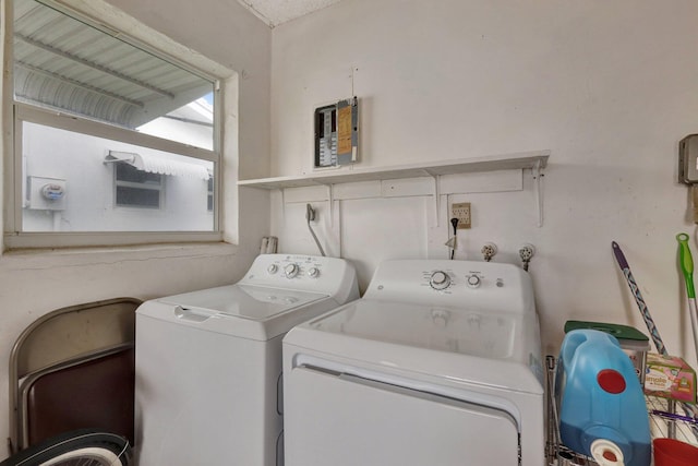 laundry area with washing machine and clothes dryer