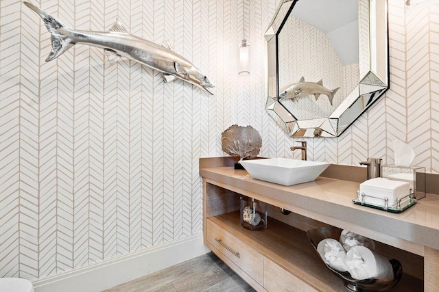 bathroom featuring hardwood / wood-style floors and vanity