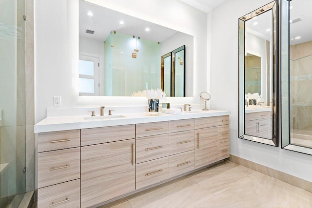 bathroom featuring a shower, vanity, and tile patterned floors