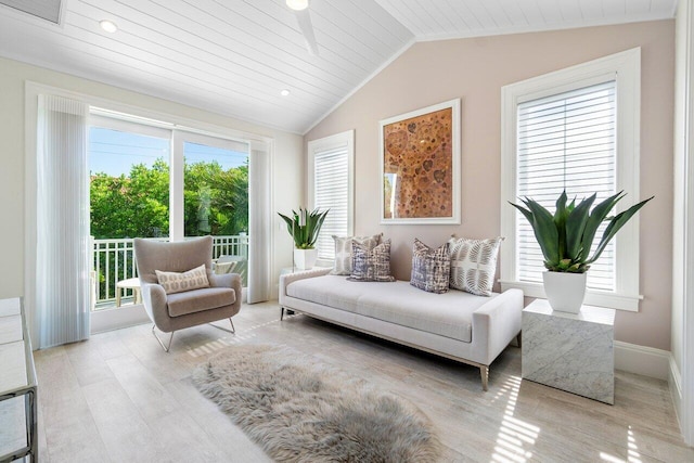 sunroom with a healthy amount of sunlight, wood ceiling, and vaulted ceiling