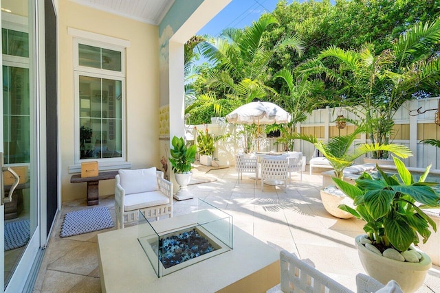 view of patio / terrace featuring an outdoor living space with a fire pit