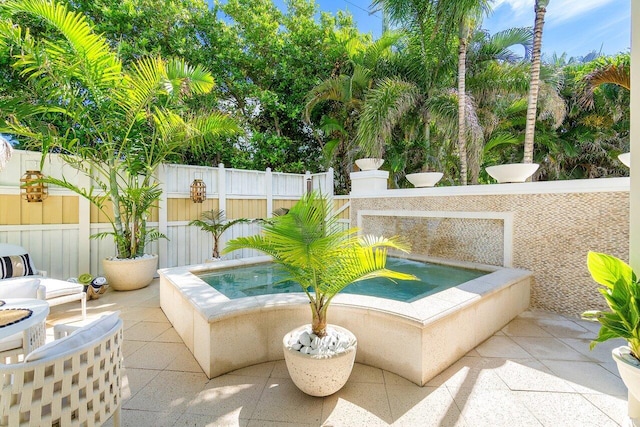 view of patio featuring an outdoor hot tub