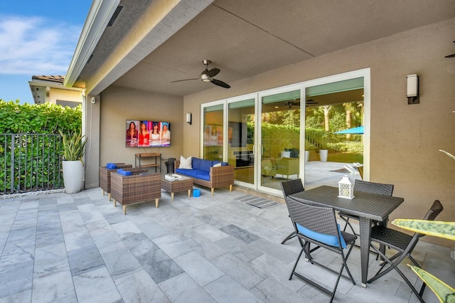 view of patio / terrace featuring ceiling fan and an outdoor living space