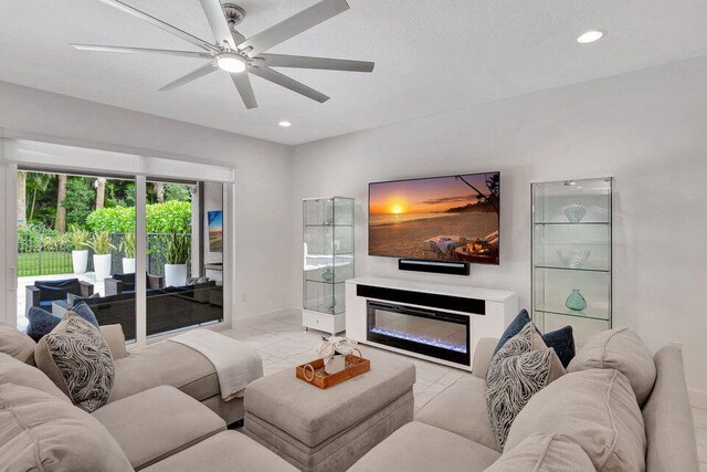 tiled living room featuring ceiling fan