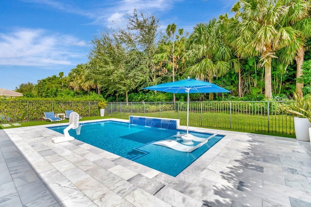 view of pool featuring a patio area and pool water feature