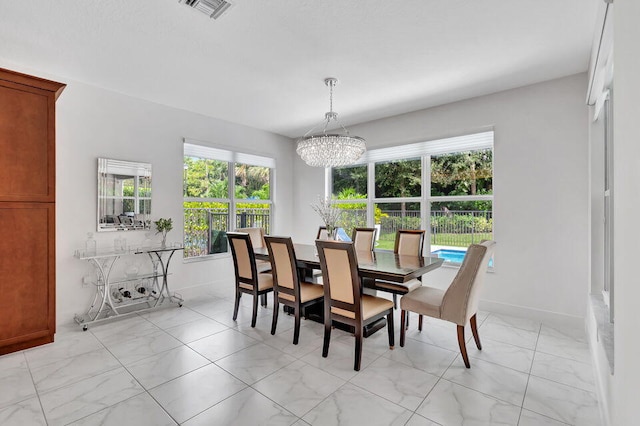 dining room featuring a chandelier