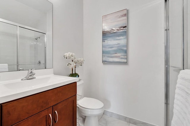 bathroom with vanity, toilet, and walk in shower