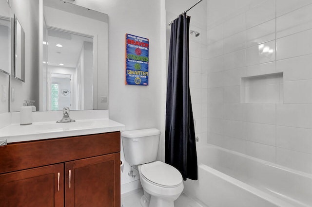 full bathroom featuring shower / bath combo, vanity, and toilet