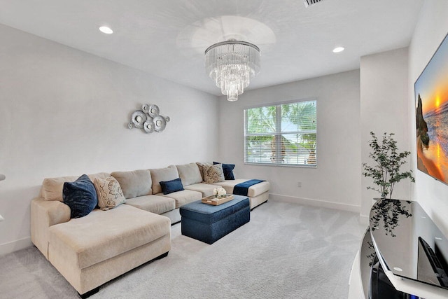 carpeted living room with a notable chandelier