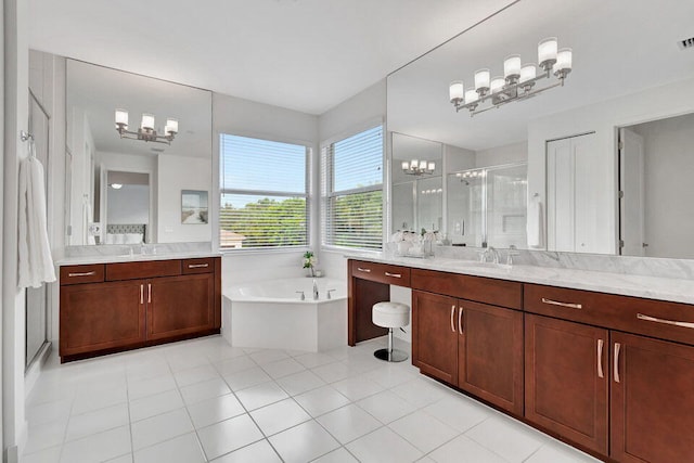 bathroom with tile patterned flooring, vanity, shower with separate bathtub, and a chandelier