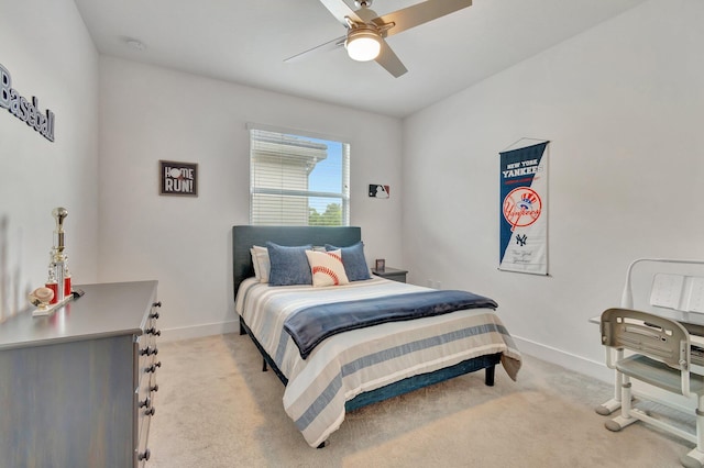 bedroom featuring ceiling fan and light carpet