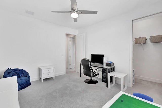 home office featuring ceiling fan and light colored carpet