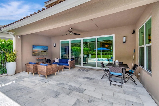 view of patio featuring an outdoor living space and ceiling fan