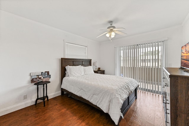 bedroom with ceiling fan and dark hardwood / wood-style floors