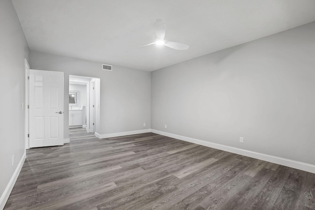 spare room with hardwood / wood-style flooring and ceiling fan