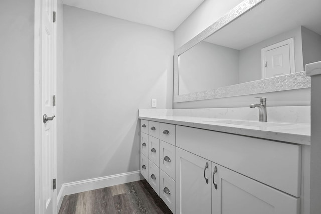 bathroom with wood-type flooring and vanity