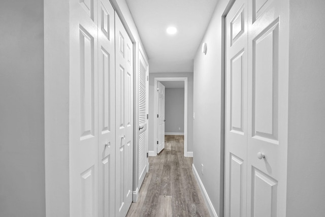 hallway featuring wood-type flooring