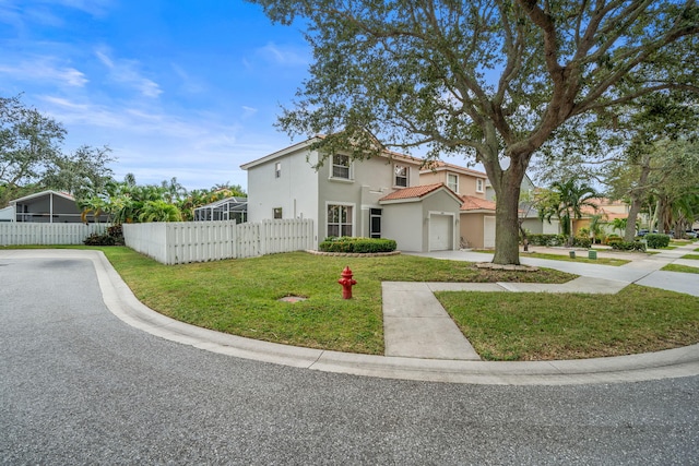 view of front facade with a garage and a front yard