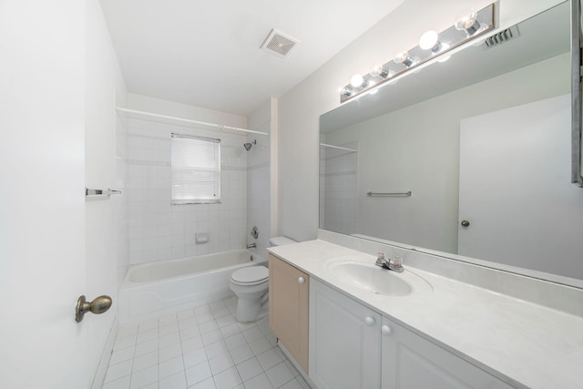 full bathroom with toilet, vanity, tiled shower / bath, and tile patterned flooring