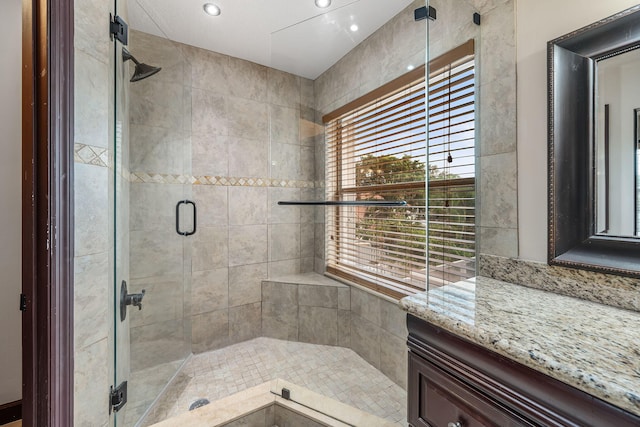 bathroom with a shower with shower door