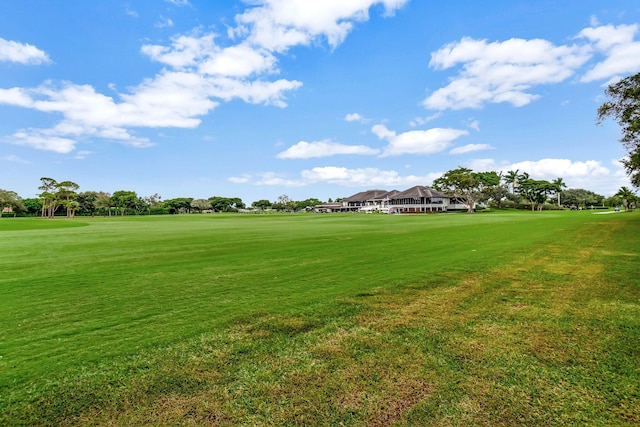 view of home's community with a yard