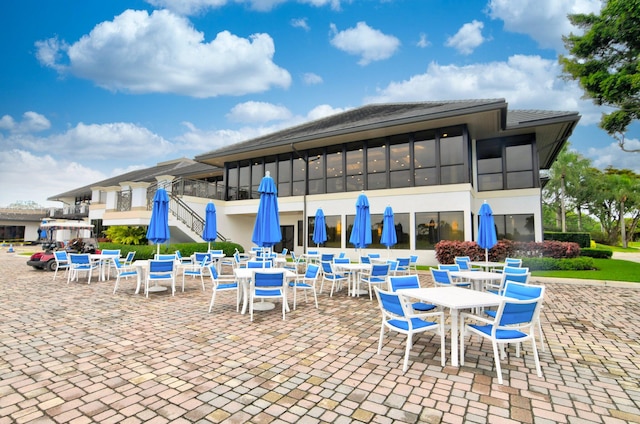 view of patio with a sunroom