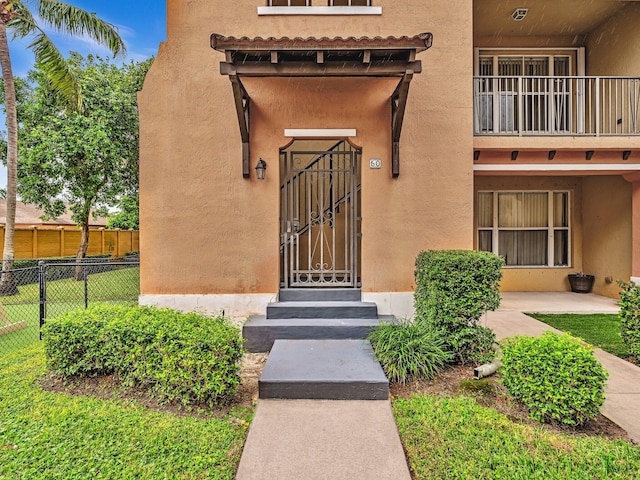 doorway to property featuring a balcony