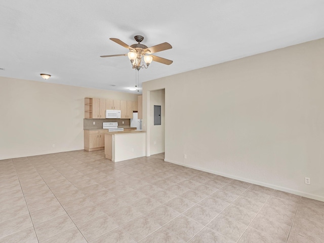 unfurnished living room featuring electric panel, ceiling fan, and light tile patterned floors